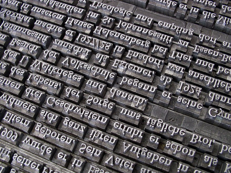Physical typesetting of a short text, photo.