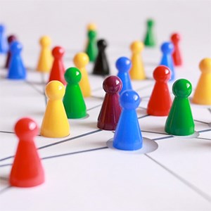 Game pieces in different colors on a game board, photo.