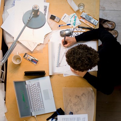 Photo of a studying student from above.