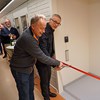 Göran Ericsson and Mikael Elofsson cut a red ribbon