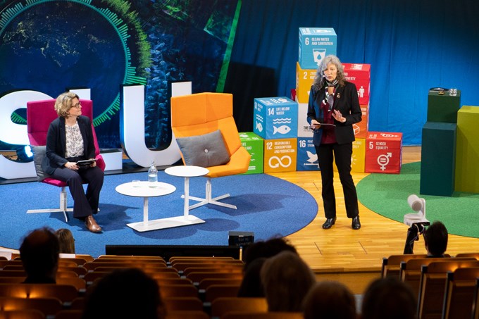 Picture of Vice-Chancellor Maria Knutson Wedel giving her welcoming speech at the inauguration lectures. On stage is also Malin von Essen, moderator of the event.