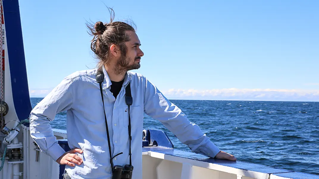 Man looking out over sea