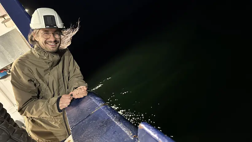 Man on ship in heavy wind