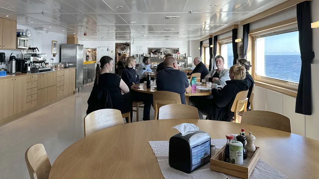 Interior with people around tables