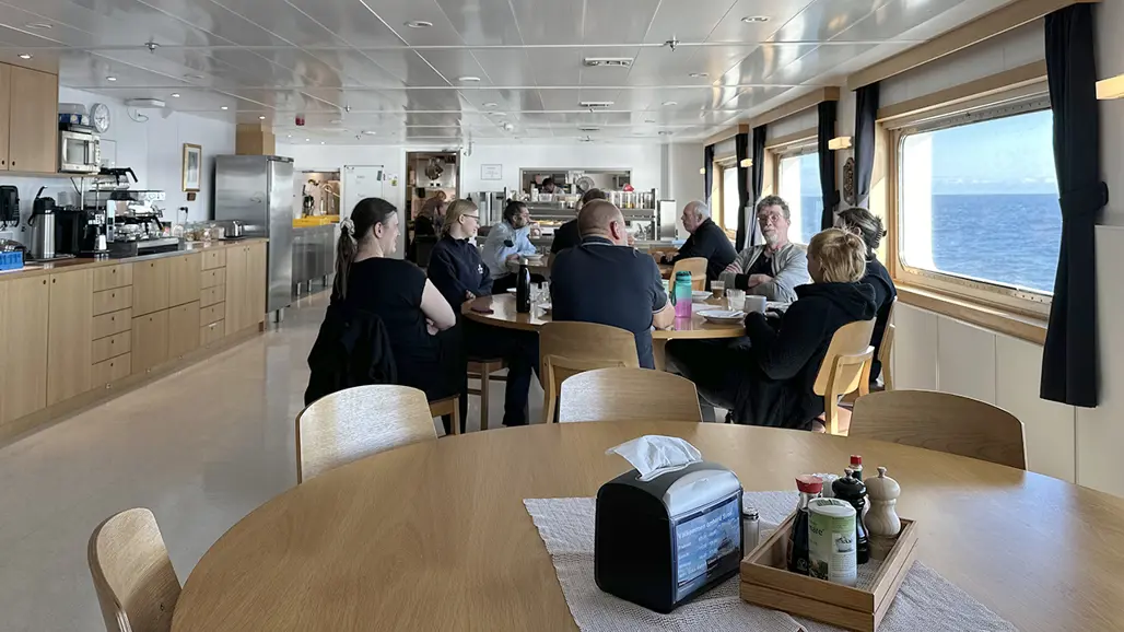 Interior with people around tables