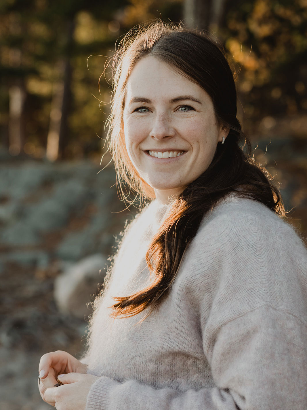 Close-up of a woman with long brown hair. 