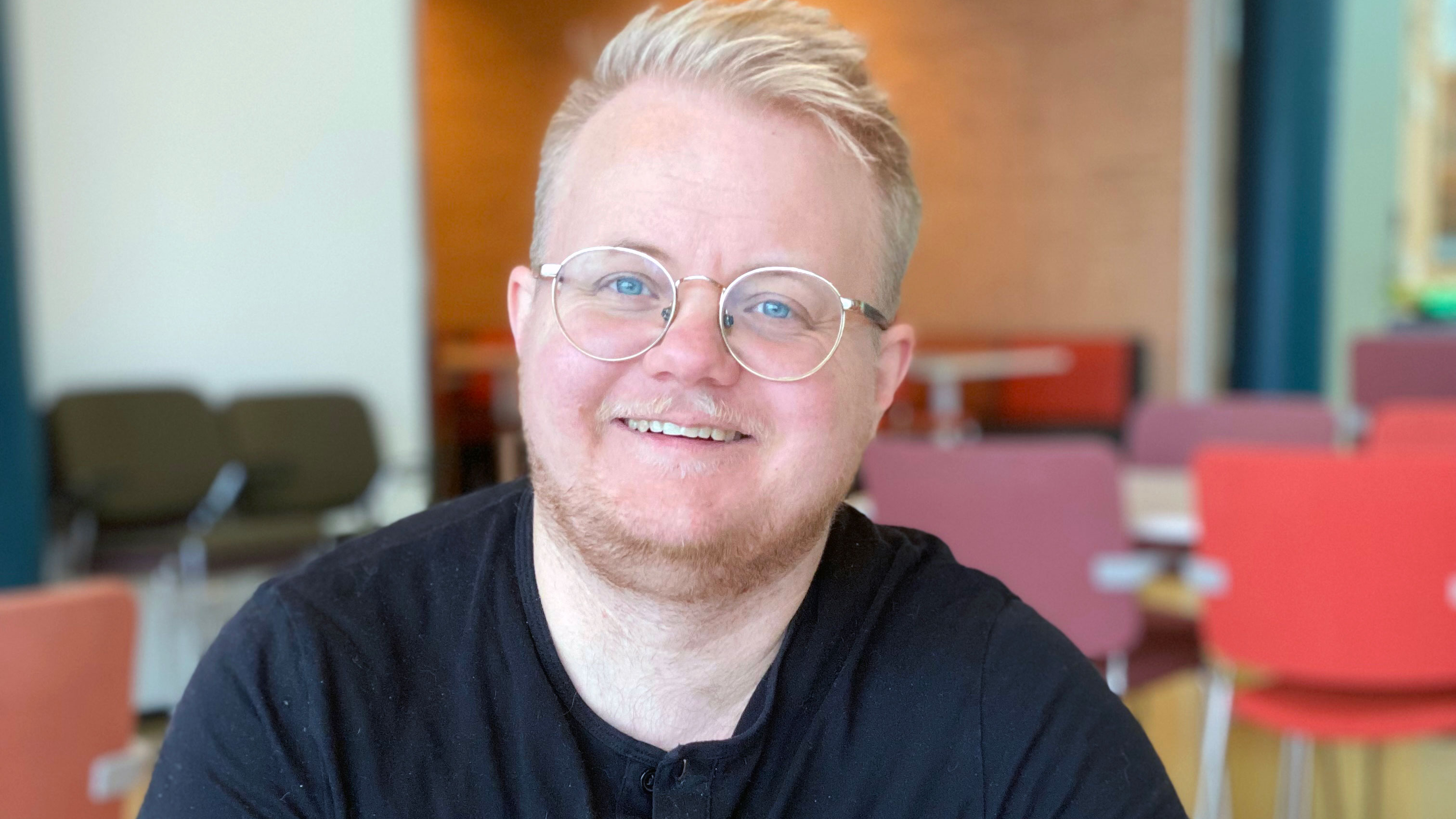 Close-up of a researcher wearing glasses.