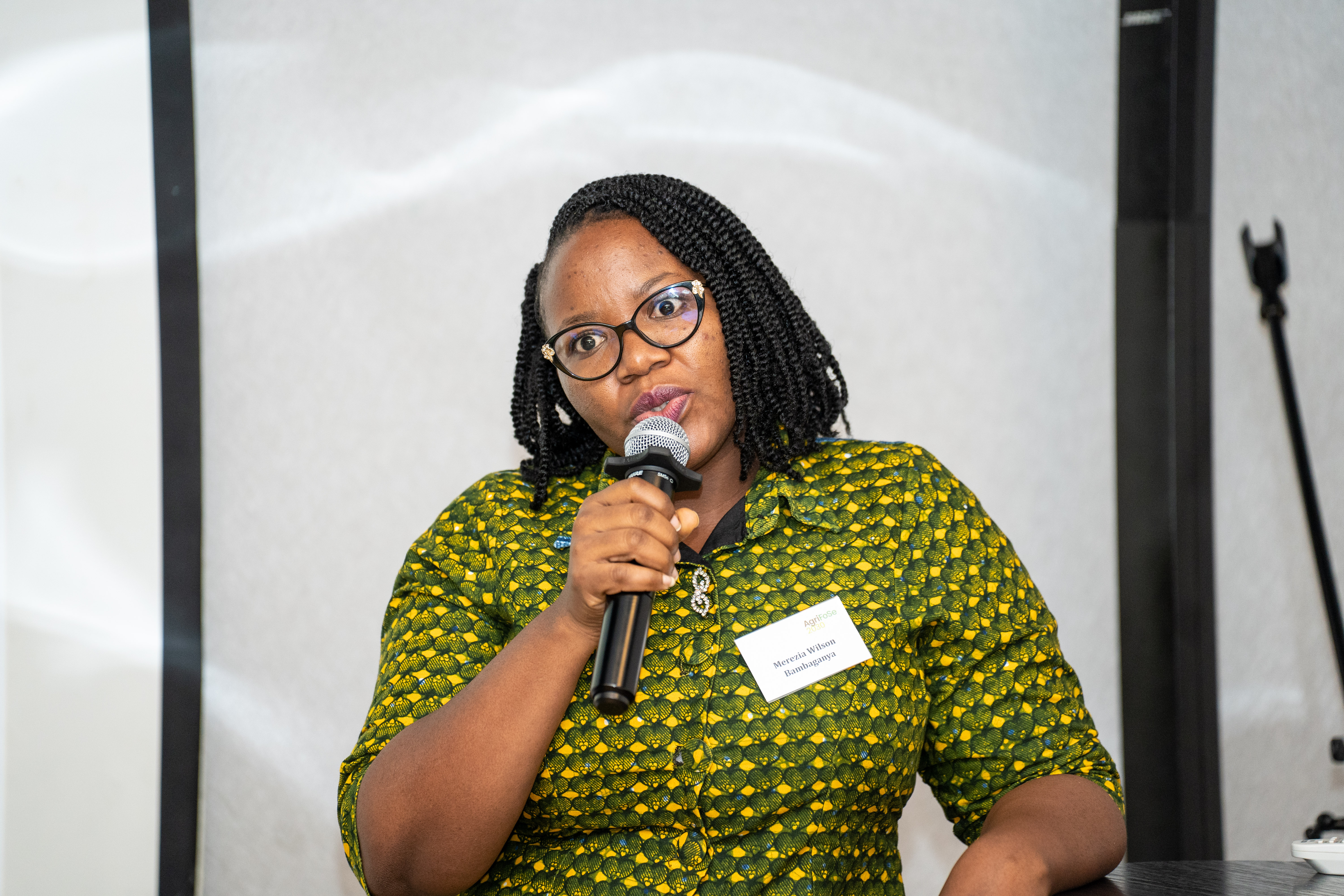 Woman talking holding a microphone