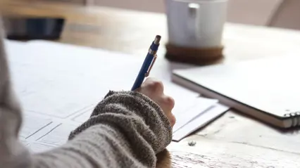 A person is writing